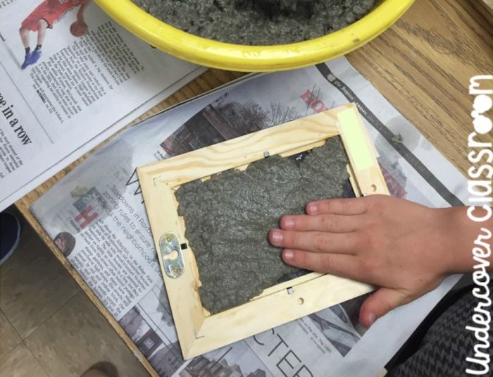 3rd Grade Science Paper Undercover Classroom Science student making recycled paper using a wood frame covered in wire mesh