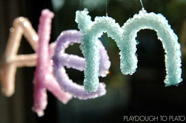 4th Grade Science Experiments Crystals Playdough to Plato Crystalized pipe cleaner letters against a black background