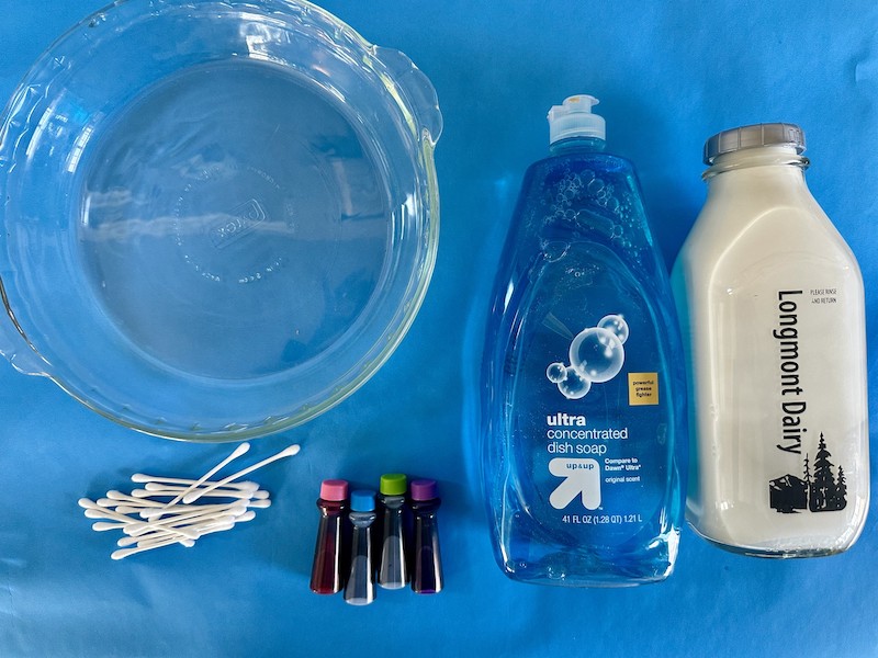 Magic-Milk-Experiment-Materials Milk, dish soap, food coloring, and cotton swabs for magic milk experiment