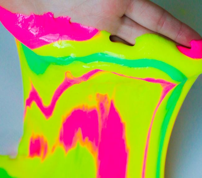 Second Grade Science: Tie Dye Slime Student playing with neon colored slime