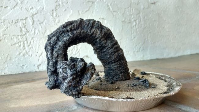 Sixth Grade Science Carbon Sugar Snake Large carbon ash snake growing out of a pan of sand
