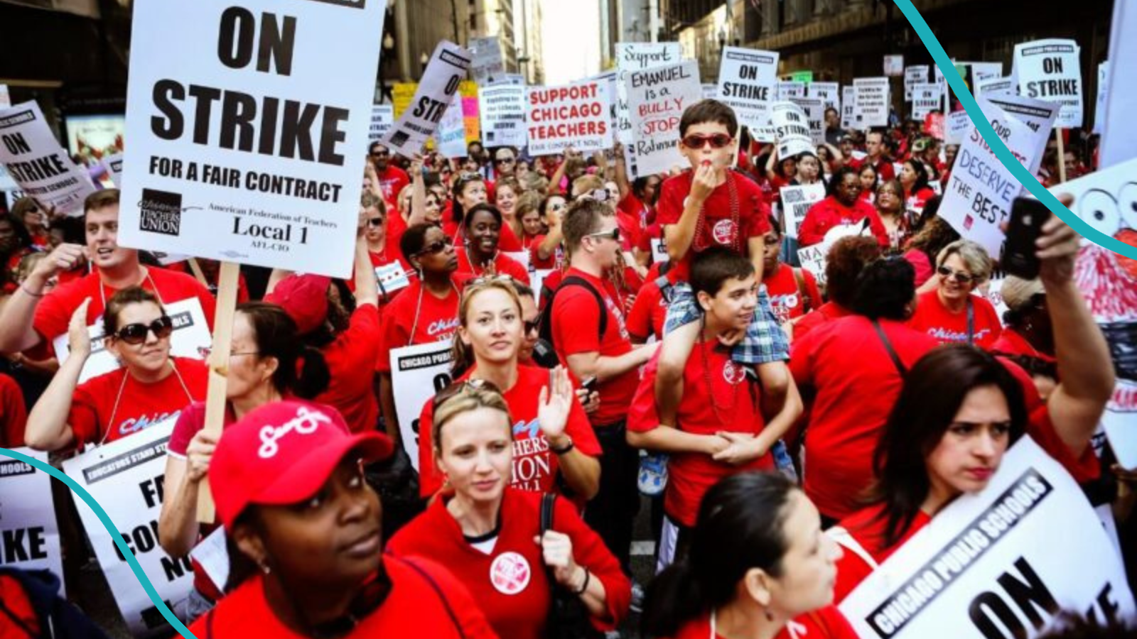 Chicago teachers union on strike holding signs in street.